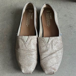 Gold sparkles TOMS shoes size 8.5W
